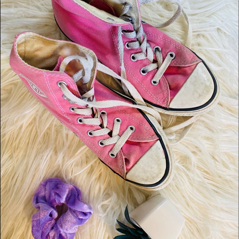 Pink Chuck Taylor Converse High Tops.